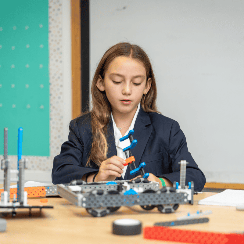 Signature Programs - Robotics Student building robot