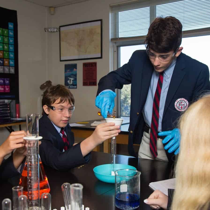 VN5D0316 Students conducting an experiment in science lab